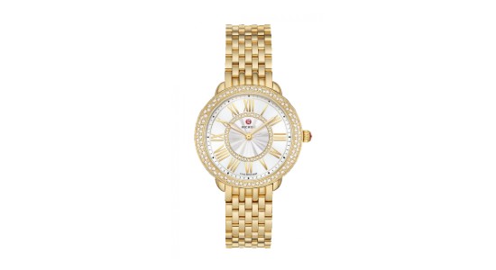 a yellow gold Michele watch featuring a row of tiny diamonds set into the bezel