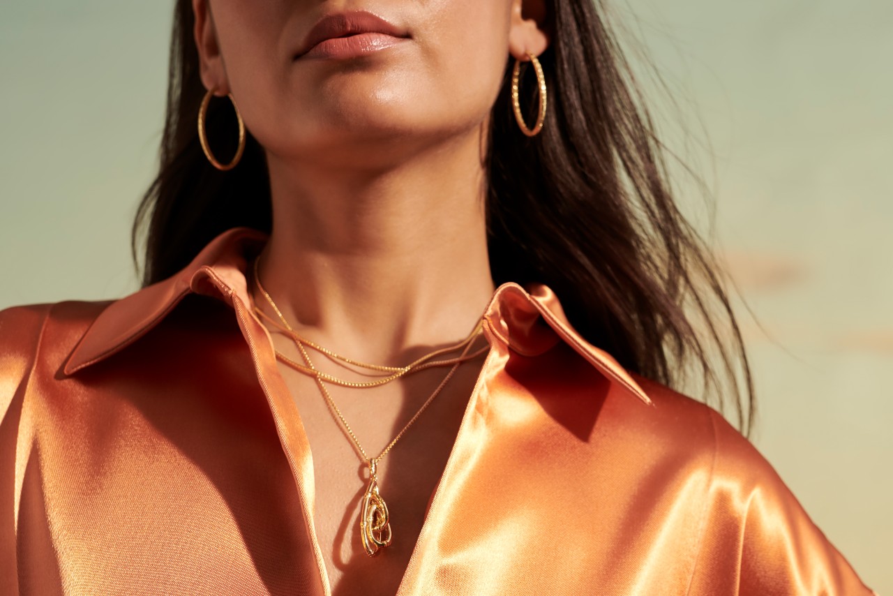John Hardy necklaces and earrings on a woman getting ready for a lovely New Year&rsquo;s Eve