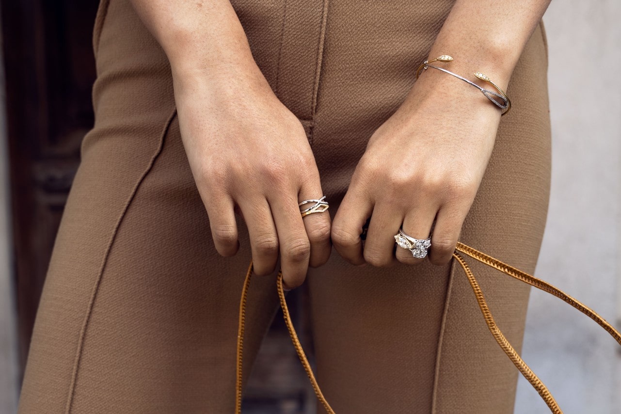 a lady&rsquo;s hands wearing TACORI jewelry