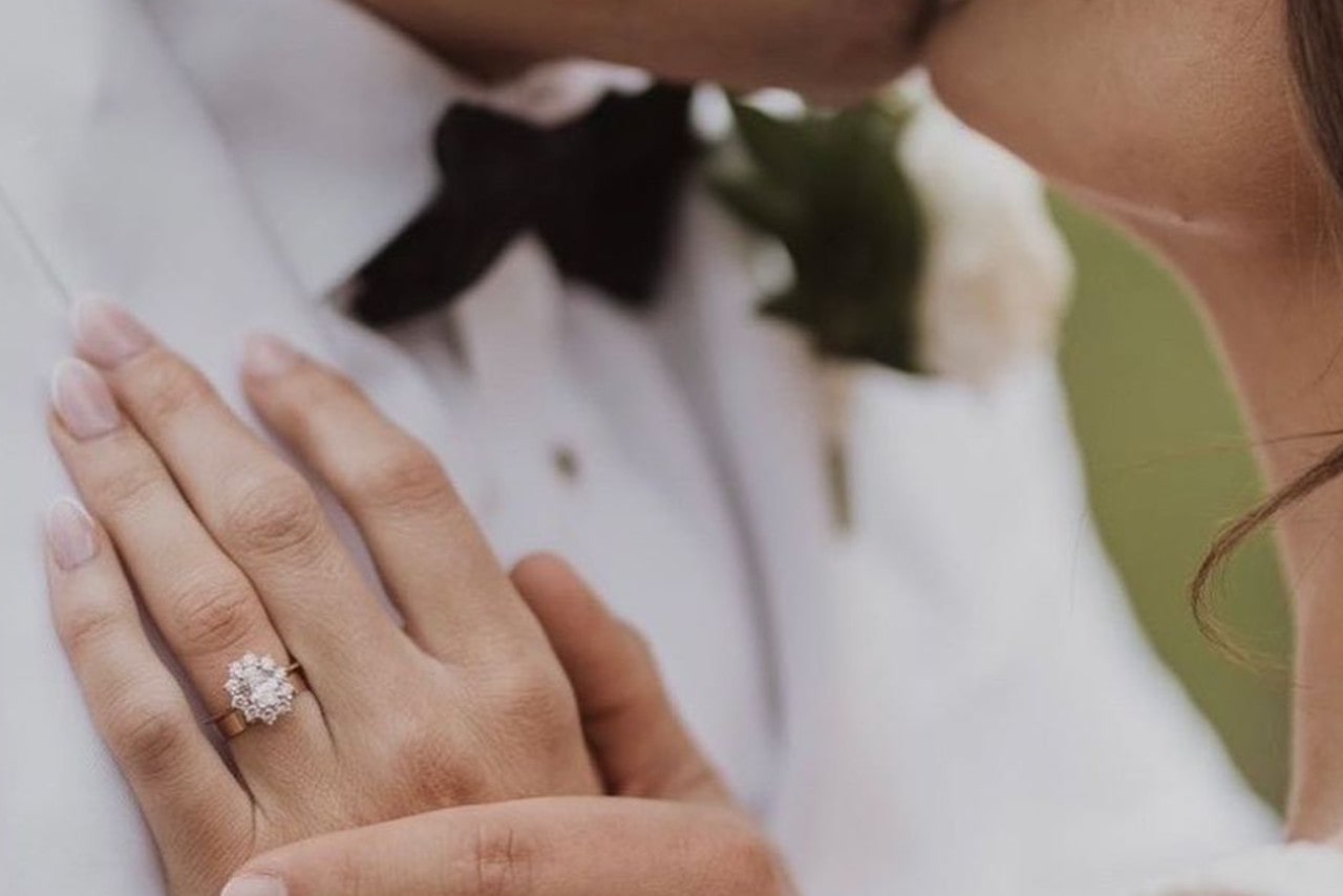 Engagement ring with wedding band right after the ceremony with the groom.